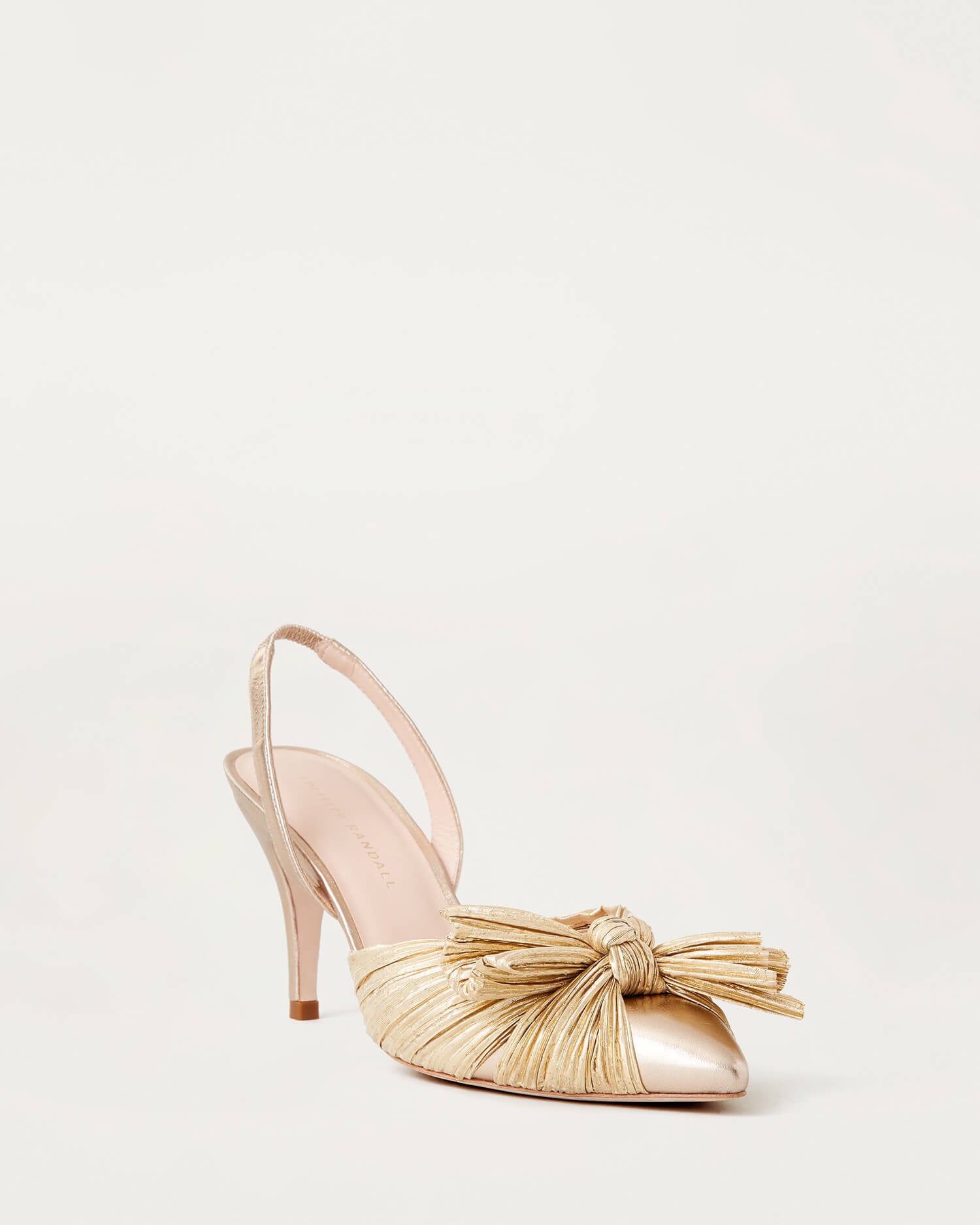 Loeffler Randall Sylvana Pleated Knot Slingback Pump in gold metallic — 2026 wedding guest hero