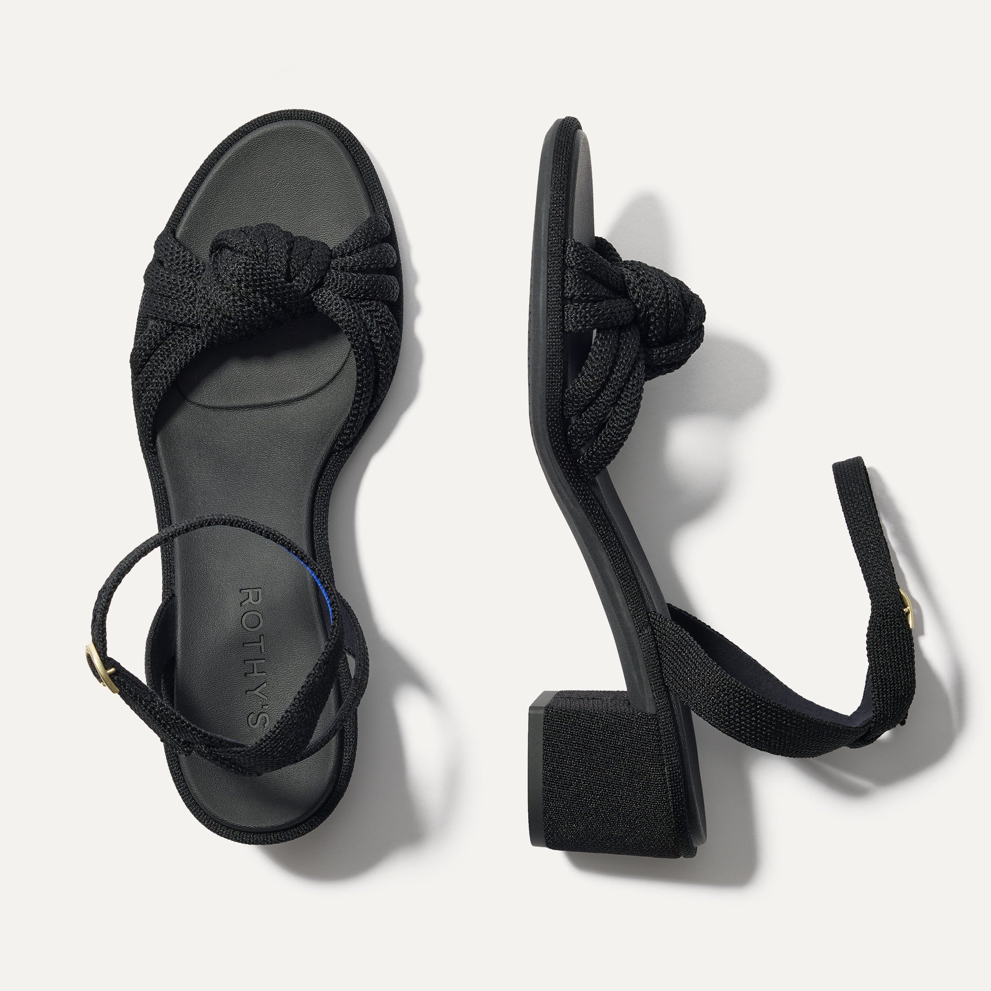 Rothy's The Knot Sandal in black recycled knit with 2-inch block heel, overhead studio shot