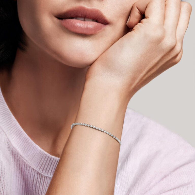 Lab-grown diamond tennis bracelet styled on a model's wrist