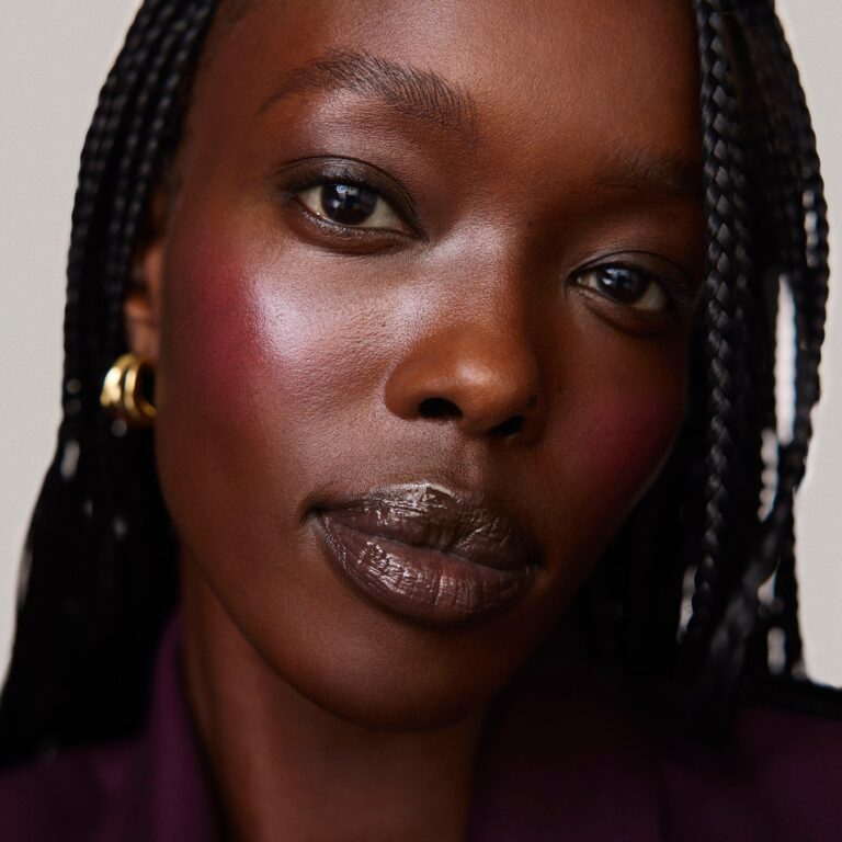 Model wearing creamy cream blush flush on cheeks
