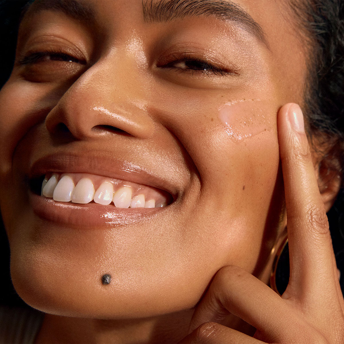Woman applying peptide serum to face — best peptide serums under $100 for mature skin 2026