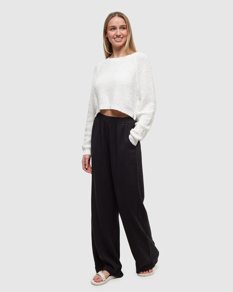 Woman wearing sustainable TENCEL wide-leg trousers for fall 2026