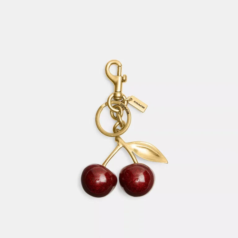 Coach glittery red cherry resin bag charm with gold clasp