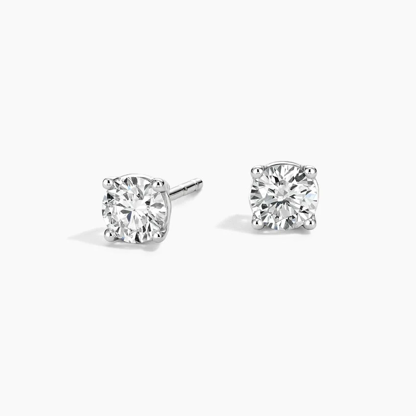 Lab-grown diamond four-prong stud earrings in recycled white gold on white background