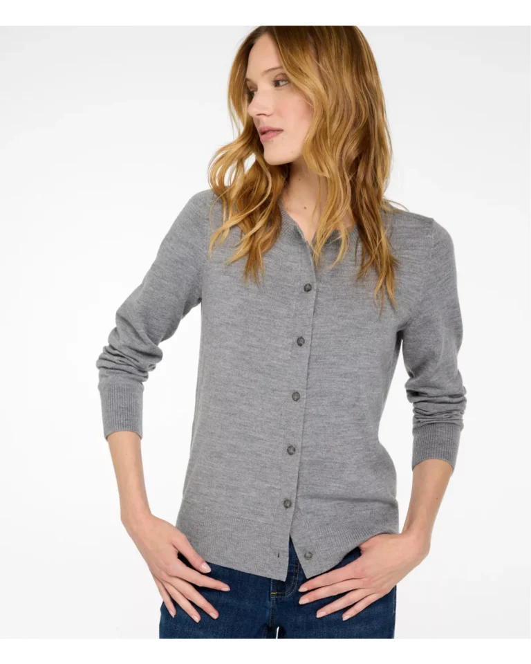 Woman wearing a machine-washable merino wool button-front cardigan with jeans