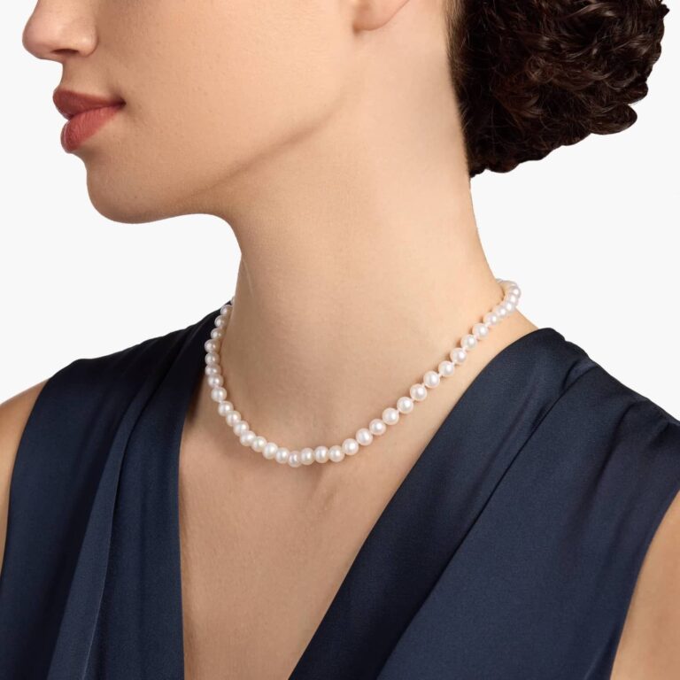 Woman wearing a classic white freshwater pearl strand necklace